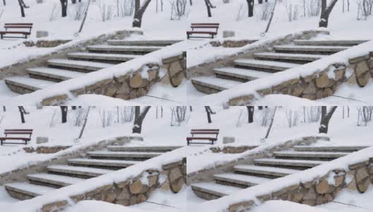 冬天公园下雪，在寒冷的雪季用雪堆砌筑楼梯高清在线视频素材下载