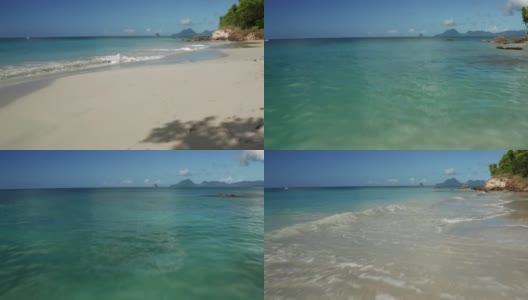 加勒比海岛上的沙滩，碧蓝的海水和蔚蓝的天空高清在线视频素材下载