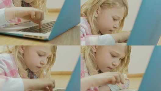 女孩用一根手指在笔记本电脑上打字高清在线视频素材下载