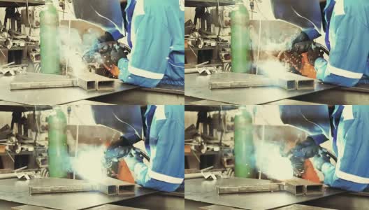 工厂中焊接钢件的焊工高清在线视频素材下载