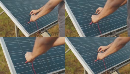 男性的手在户外用万用表检查太阳能电池板的电压的特写。能胜任太阳能电站的控制工作。用万用表检查太阳能板电压高清在线视频素材下载