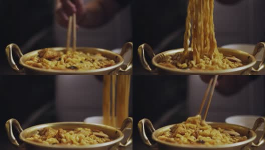 近距离观察一个人用筷子夹着金碗吃方便面高清在线视频素材下载