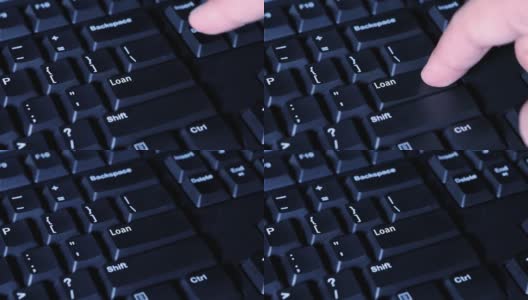 视频画面显示，一名男性手指按下了电脑键盘上的“借出”键高清在线视频素材下载