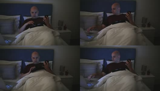 疲惫的秃顶男人在床上工作高清在线视频素材下载