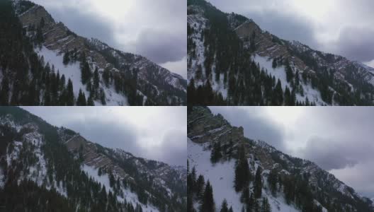 冬天，无人机在犹他州普罗沃峡谷的山腰拍摄降雪高清在线视频素材下载