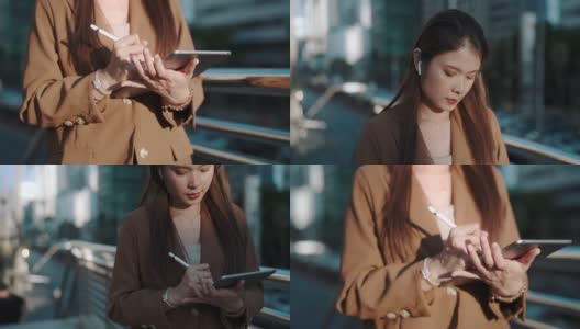 亚洲女性在城市的办公中心用智能手机发短信高清在线视频素材下载