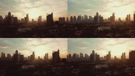 雅加达,印度尼西亚。2018年1月23日:雅加达黄昏时分摩天大楼和阳光的美丽航拍城市景观。拍摄分辨率为4k高清在线视频素材下载