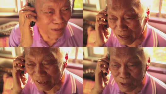 一个年长的亚洲人在打手机高清在线视频素材下载