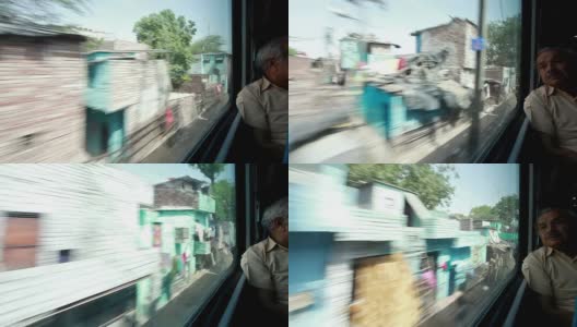印度一列火车经过贫民窟高清在线视频素材下载