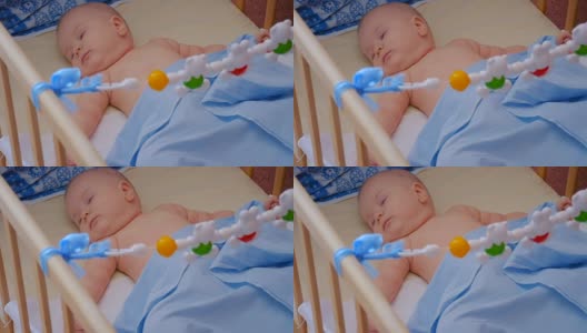 小婴儿在他的婴儿床里睡觉，靠近点高清在线视频素材下载