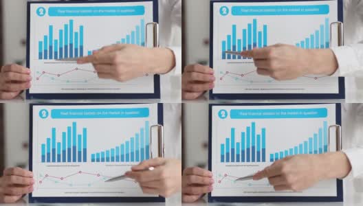 女商人展示真实的金融统计数据市场问题图表特写高清在线视频素材下载