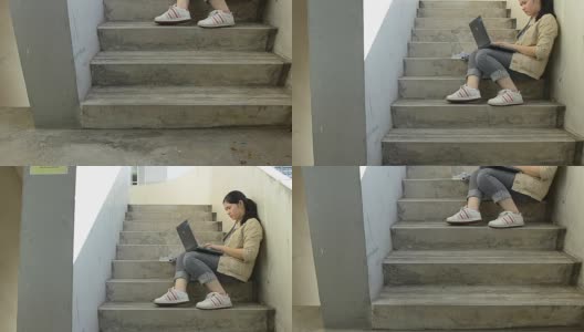 panning:忙碌的女商人坐在梯子上使用笔记本电脑高清在线视频素材下载