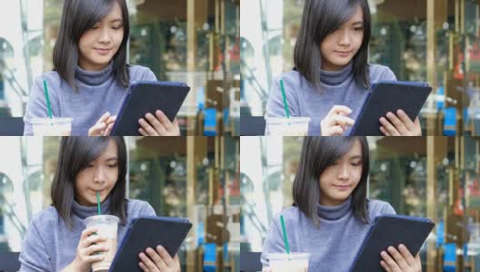 在咖啡店里用平板电脑的女人高清在线视频素材下载