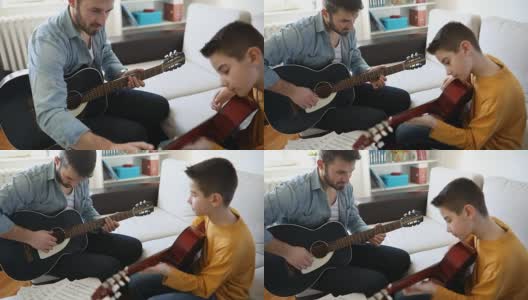 男孩在家里学弹吉他高清在线视频素材下载