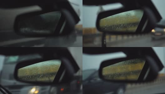 擦拭汽车后视镜挡风玻璃上的雨滴高清在线视频素材下载