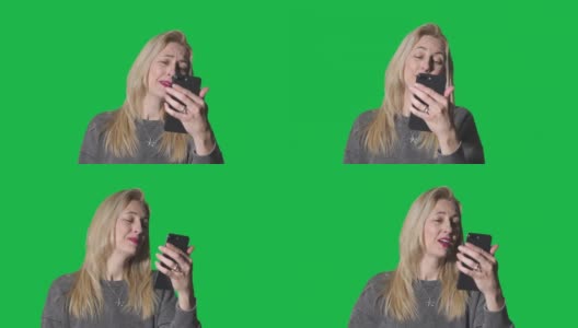 中年妇女视频聊天在电话上的绿色屏幕高清在线视频素材下载