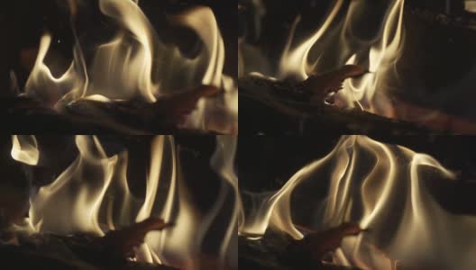 SLO MO特写木材燃烧壁炉燃烧的缓慢动作。砖砌壁炉里温暖舒适的燃烧着的火靠近了。舒适的背景。高清在线视频素材下载