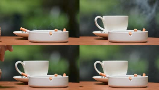 一名男子在室外抽烟喝咖啡时谈话的画面高清在线视频素材下载