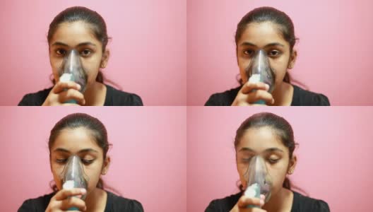 印度少女喷雾器自己治疗高清在线视频素材下载