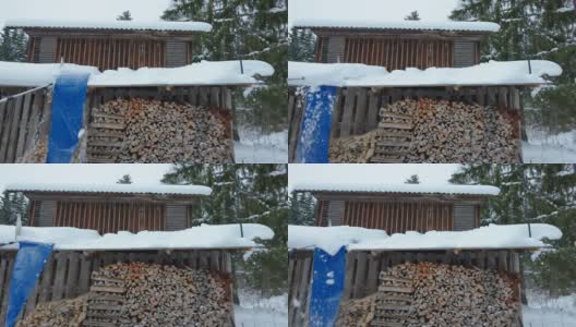 爱沙尼亚木屋上的木柴和厚厚的积雪高清在线视频素材下载