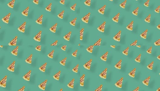 披萨的彩色图案孤立在绿色背景与阴影。披萨切片的无缝图案。前视图。现实的动画。4 k视频运动高清在线视频素材下载