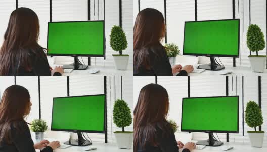 女商人使用电脑绿屏，色度键高清在线视频素材下载