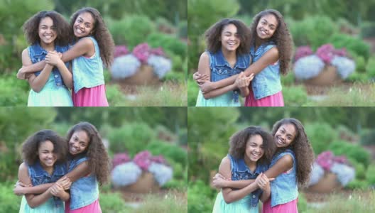两个非裔美国姐妹在花园里微笑高清在线视频素材下载