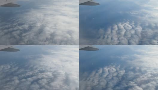 乘飞机旅行。从飞机窗口鸟瞰。美丽的cloudscape。高清在线视频素材下载