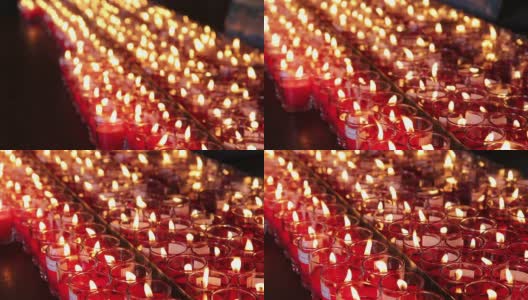 中国寺庙里成排燃烧的蜡烛高清在线视频素材下载