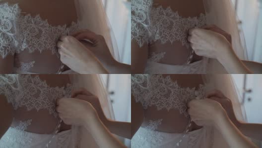 新娘正在系婚纱高清在线视频素材下载