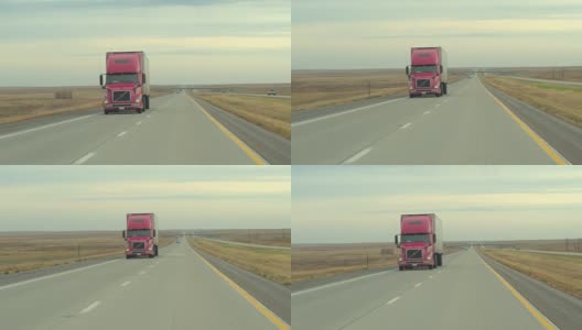 AERIAL:风景优美、交通繁忙的高速公路贯穿草原平原高清在线视频素材下载