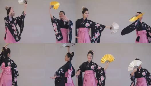 两个艺妓穿着传统的日本和服与扇子跳舞高清在线视频素材下载