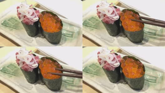 三文鱼卵和金枪鱼寿司，用筷子吃高清在线视频素材下载
