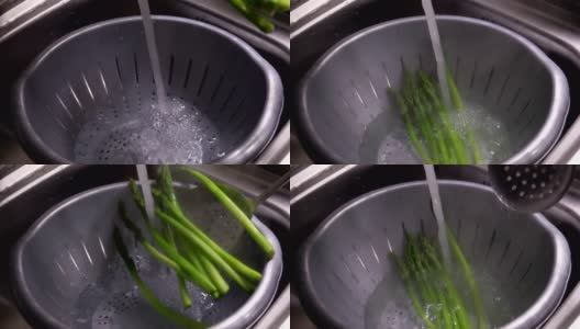 煮熟的芦笋茎放在冷水中高清在线视频素材下载