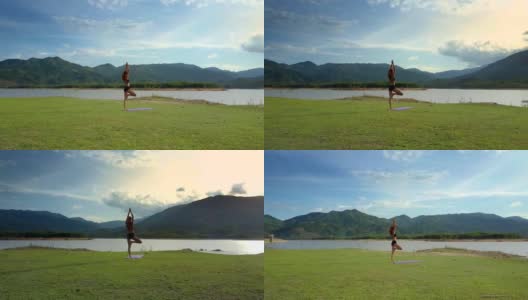 Flycam View Girl站在瑜伽姿势对着Shining River高清在线视频素材下载