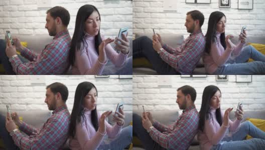 沮丧沮丧的夫妻吵架后坐在家里的沙发上高清在线视频素材下载