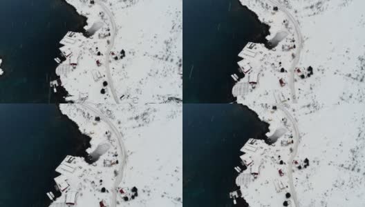 冬天，挪威罗浮敦群岛海岸线上的渔村公路上有雪高清在线视频素材下载