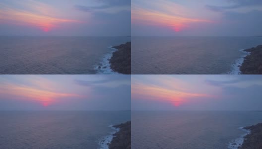 宁静的海景与陡峭的悬崖与早晨的太阳鸟瞰图高清在线视频素材下载