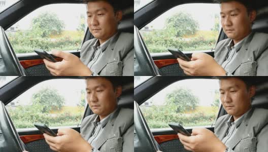 一名司机在车上使用智能手机高清在线视频素材下载