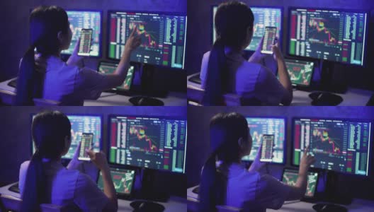 金融顾问亚洲女商人一边工作到深夜，一边分析和学习股票市场和加密货币图表高清在线视频素材下载