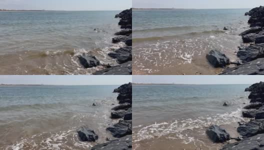 海浪拍打着岸边的岩石高清在线视频素材下载