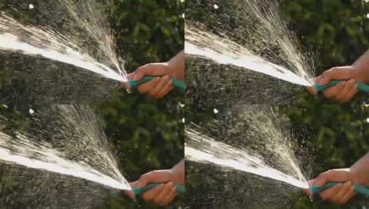 slow-motion, people watering tree in garden高清在线视频素材下载