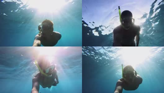 年轻男子戴着浮潜面罩潜水高清在线视频素材下载