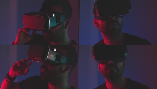 年轻人戴着VR眼镜，在彩色霓虹灯下与虚拟现实互动，未来科技，教育视频游戏高清在线视频素材下载