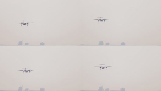 涡轮螺旋桨飞机在城市上空盘旋高清在线视频素材下载