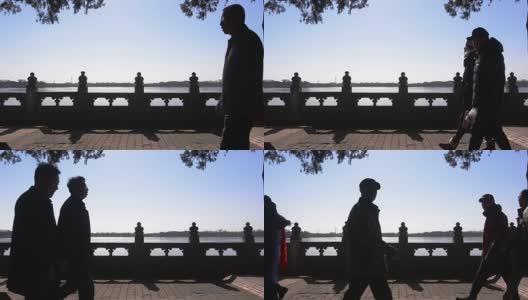 剪影:中国风格的走廊上许多游客的影子高清在线视频素材下载