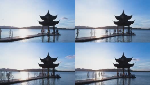 日落时分，杭州西湖上的天空和亭子。时间流逝。高清在线视频素材下载