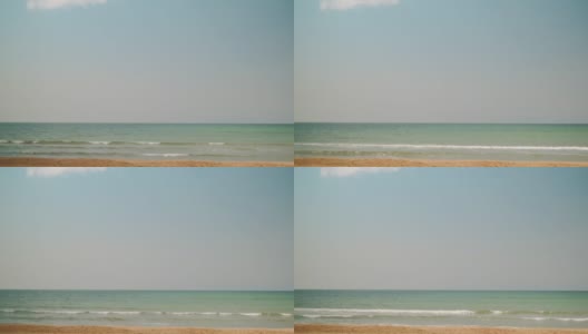 沙滩，冲浪，蓝色的海洋和天空背景，夏天的概念。正午蔚蓝天空的背景，缓缓飘浮的云朵。模糊的自然，假日或周末横幅的想法，现场视频素材高清在线视频素材下载