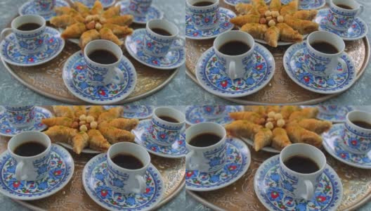 桌上有土耳其咖啡和果仁蜜饼。有选择性的重点。食物。高清在线视频素材下载