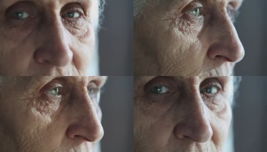 一位年长女性的眼睛转向了镜头，但她的目光却移开了高清在线视频素材下载
